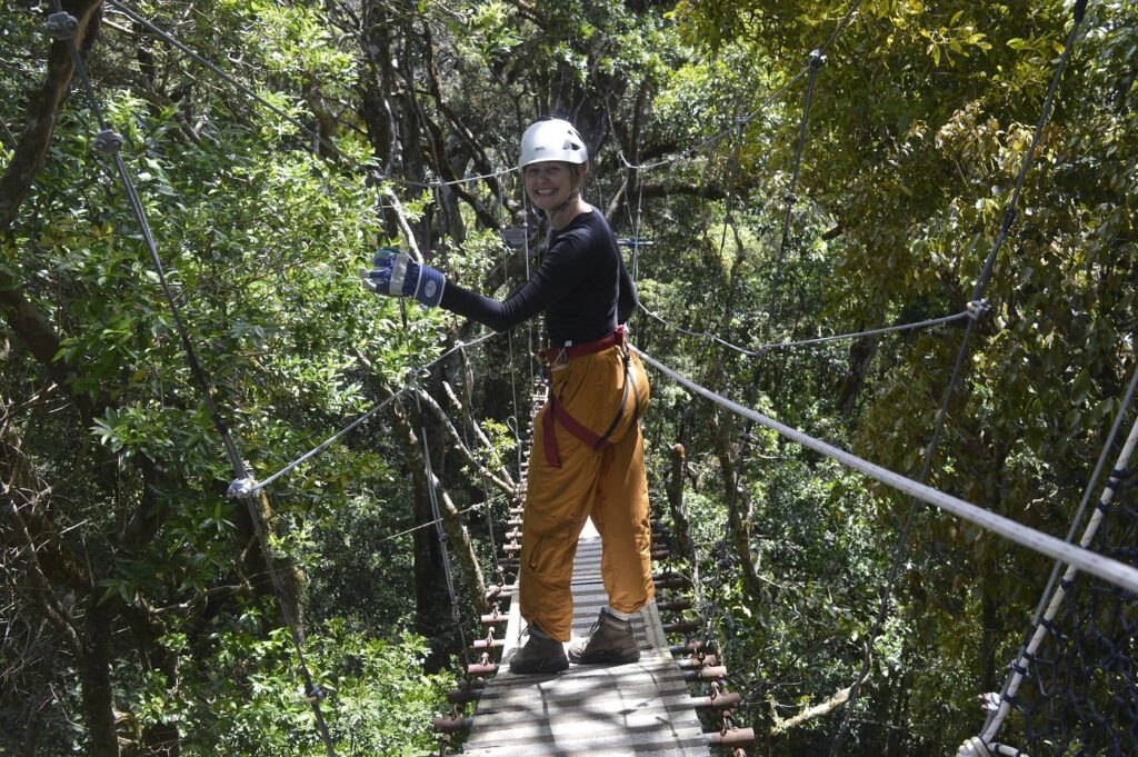 Woman walking on a hanging bridge in Costa Rica.