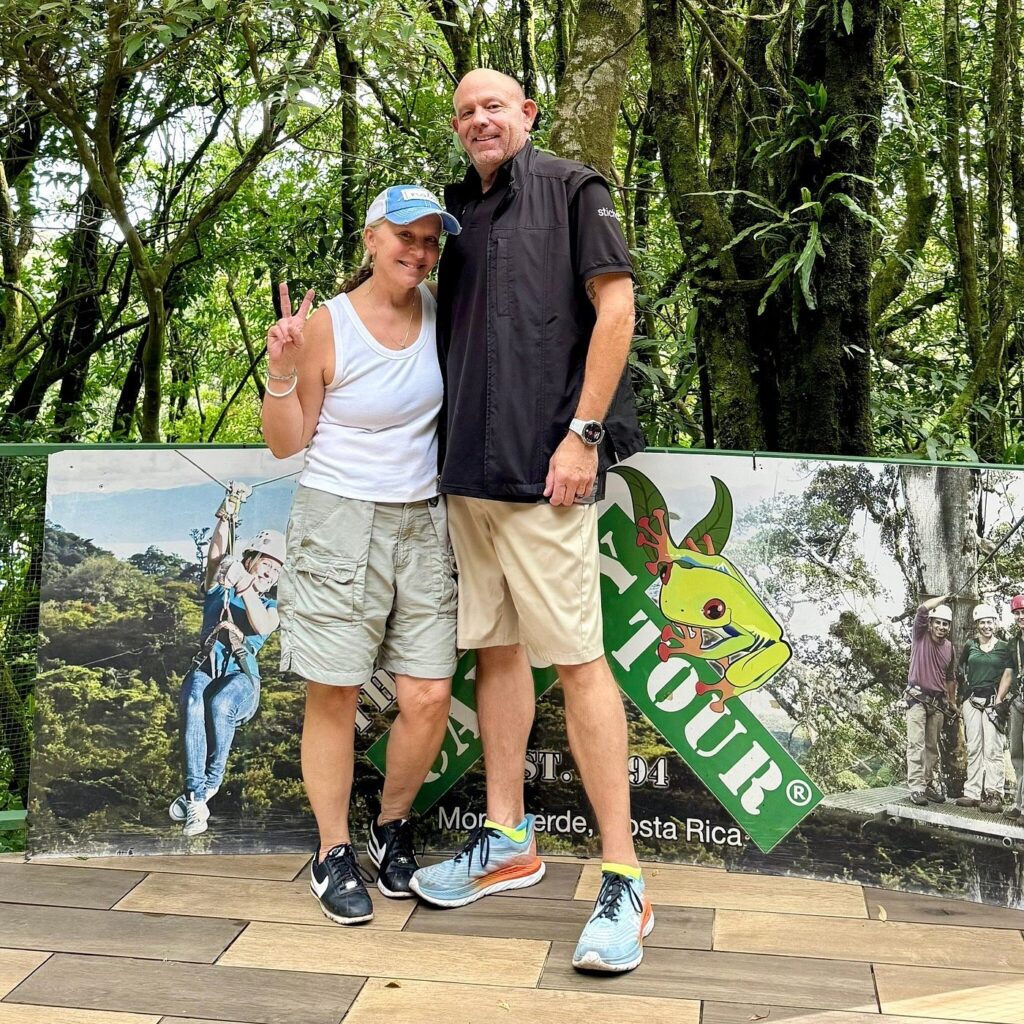 Visitors posing before ziplining in Costa Rica with The Original Canopy Tour. 