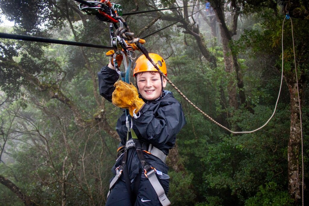 Kid smiling while trying zipiling.