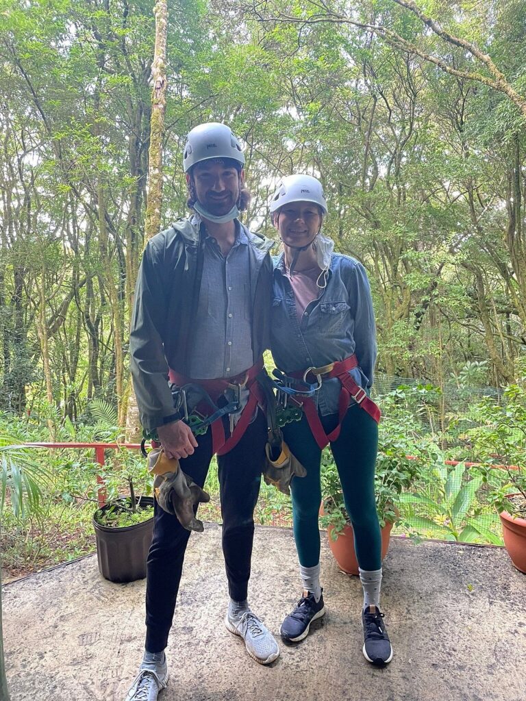 Couple wearing helmets and harnesses before a Costa Rica rainforest canopy tour.