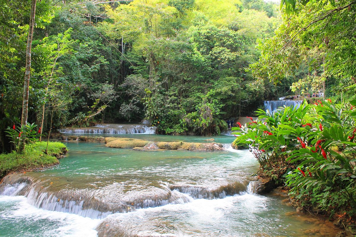 YS Falls cascading through lush tropical greenery in Jamaica.